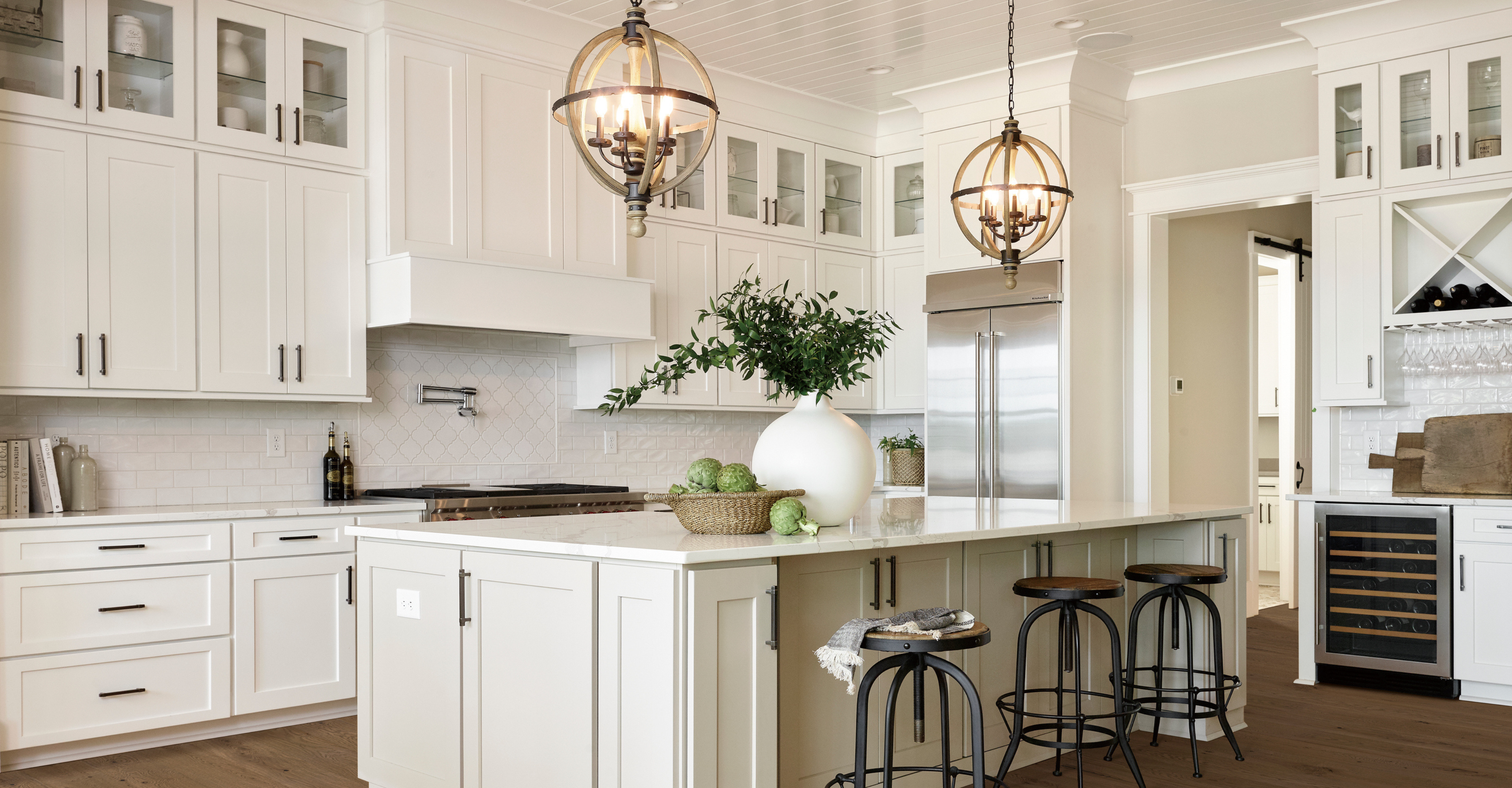 Kitchen with white custom cabinetry and countertops